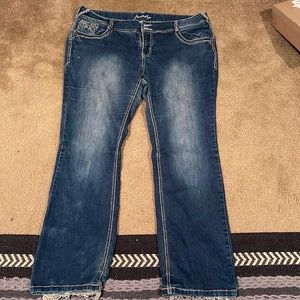 Bootcut jeans. Distressed. Super cute and flattering. Size 18